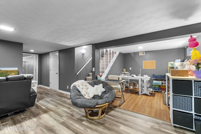 2410 Mammoth Way, Louisville, KY 40299 - living area featuring stairs, a textured ceiling, baseboards, and wood finished floors