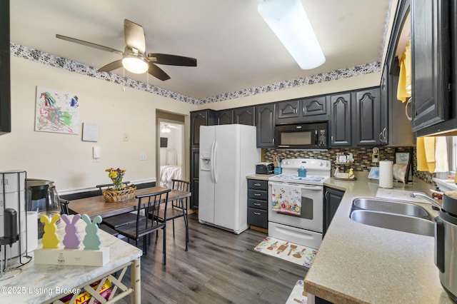 2410 Mammoth Way, Louisville, KY 40299 - kitchen featuring a sink, light countertops, a ceiling fan, white appliances, and dark wood-style floors