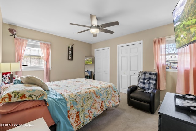 2410 Mammoth Way, Louisville, KY 40299 - bedroom with carpet flooring, a ceiling fan, and multiple closets
