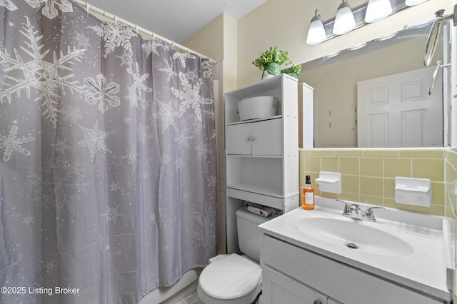 2410 Mammoth Way, Louisville, KY 40299 - full bathroom with a shower with shower curtain, toilet, tile walls, vanity, and backsplash