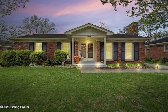 2410 Mammoth Way, Louisville, KY 40299 - ranch-style house with brick siding, a chimney, and a front lawn