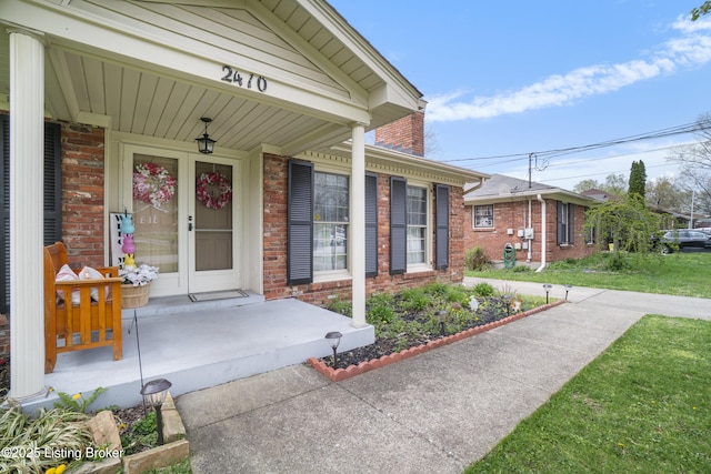 2410 Mammoth Way, Louisville, KY 40299 - view of exterior entry with brick siding and a porch
