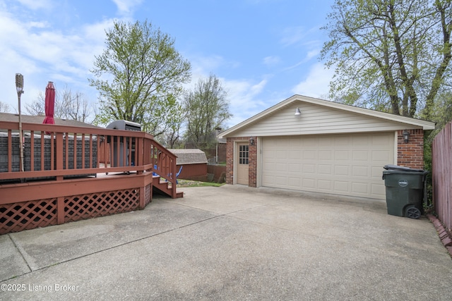 2410 Mammoth Way, Louisville, KY 40299 - view of side of property featuring a garage, brick siding, a deck, and an outdoor structure