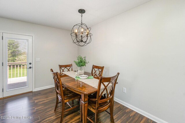 dining room featuring baseboards, dark wood-style floors, and an inviting chandelier