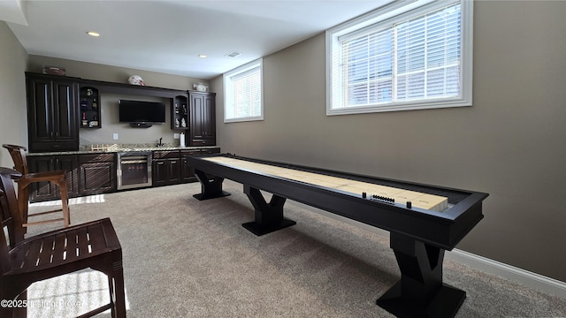 game room featuring visible vents, baseboards, indoor wet bar, carpet floors, and recessed lighting