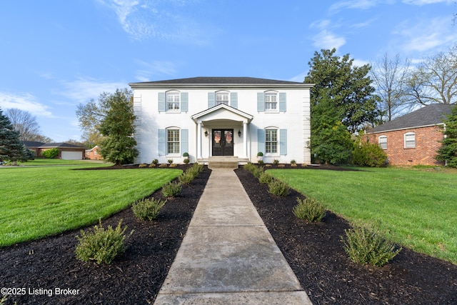 colonial-style house with french doors and a front lawn
