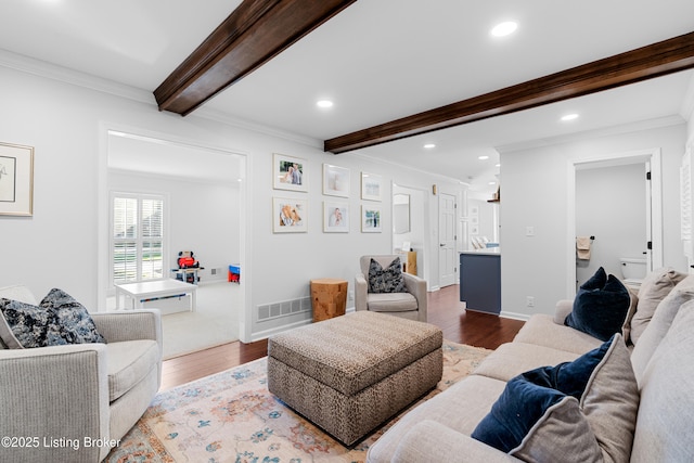 living room featuring ornamental molding, recessed lighting, visible vents, beamed ceiling, and wood finished floors