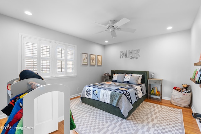 bedroom featuring wood finished floors, baseboards, a ceiling fan, and recessed lighting