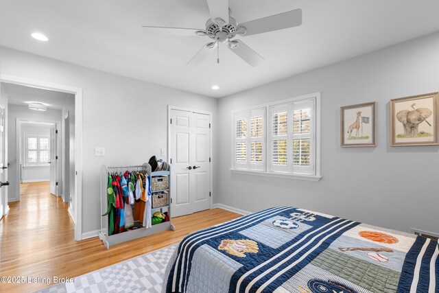 bedroom featuring baseboards, light wood finished floors, ceiling fan, and recessed lighting