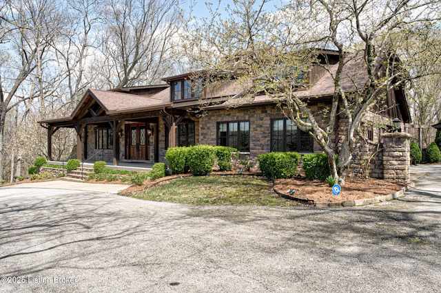 6601 Old Heady Rd, Louisville, KY 40299 - view of front of property with a porch, a shingled roof, and stone siding