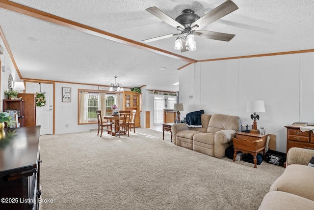 carpeted living room with crown molding, ceiling fan with notable chandelier, and a textured ceiling