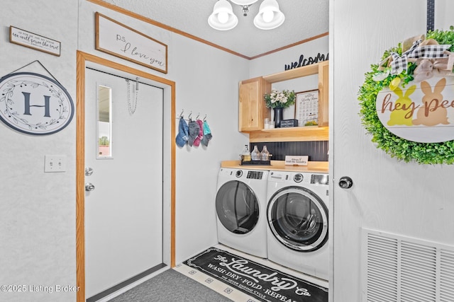 laundry room featuring visible vents, an inviting chandelier, separate washer and dryer, ornamental molding, and laundry area