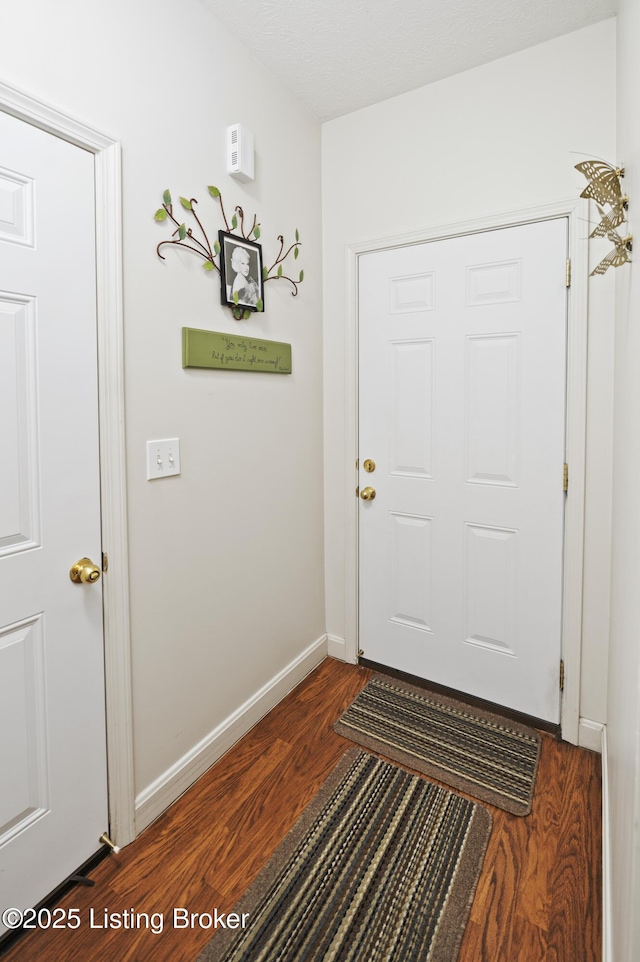 591 Arrowhead Ln, Shepherdsville, KY 40165 - doorway to outside featuring baseboards and dark wood finished floors