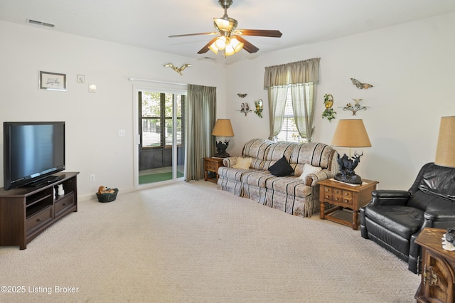 591 Arrowhead Ln, Shepherdsville, KY 40165 - living room featuring visible vents, a ceiling fan, light carpet, and a healthy amount of sunlight