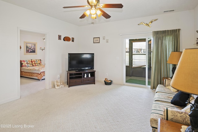 591 Arrowhead Ln, Shepherdsville, KY 40165 - carpeted living room with baseboards, a ceiling fan, and visible vents