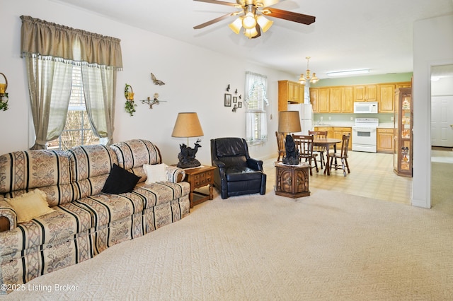 591 Arrowhead Ln, Shepherdsville, KY 40165 - living room featuring light carpet, ceiling fan with notable chandelier, and a healthy amount of sunlight