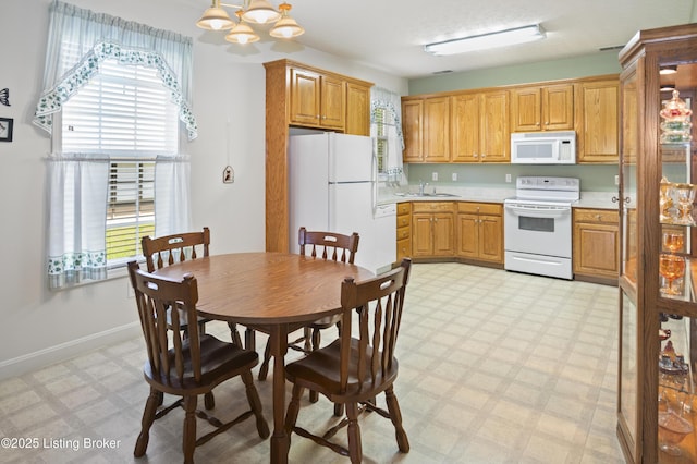 591 Arrowhead Ln, Shepherdsville, KY 40165 - kitchen with a sink, white appliances, plenty of natural light, and light floors