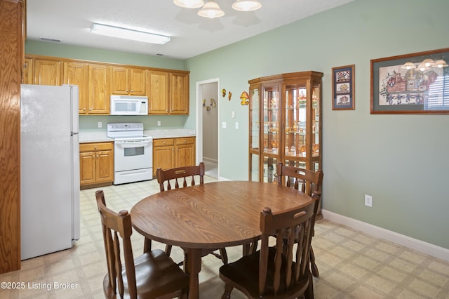 591 Arrowhead Ln, Shepherdsville, KY 40165 - dining area featuring baseboards, a notable chandelier, and light floors