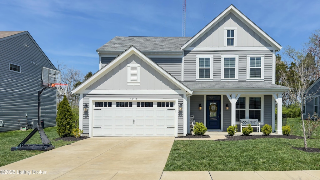 18117 Bridle Run Dr, Louisville, KY 40245 - traditional home with concrete driveway, a front lawn, board and batten siding, and covered porch