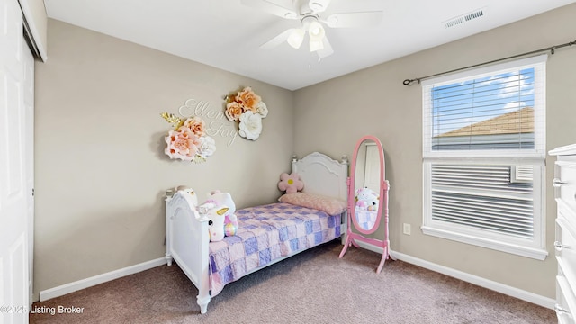 bedroom featuring carpet floors, visible vents, baseboards, and ceiling fan