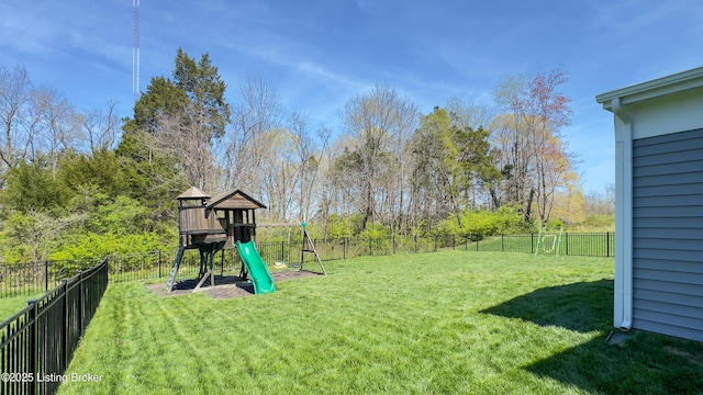 view of yard featuring a fenced backyard and a playground