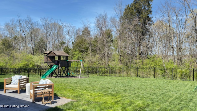 view of yard featuring fence and a playground