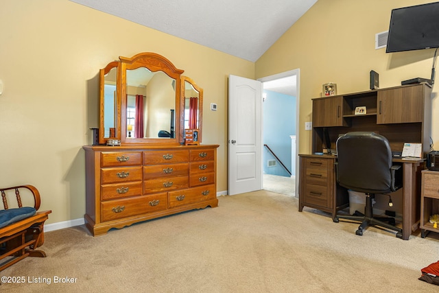 office area with light colored carpet, baseboards, and lofted ceiling