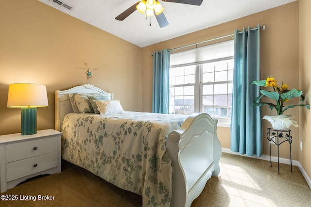 bedroom featuring ceiling fan, vaulted ceiling, visible vents, carpet flooring, and baseboards