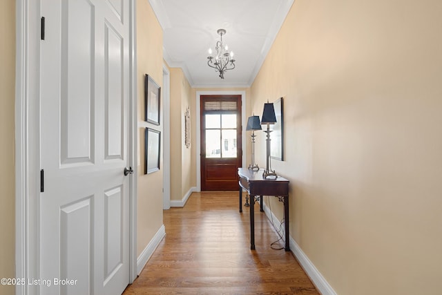 9502 Gerardia Ln, Prospect, KY 40059 - entryway featuring a chandelier, ornamental molding, wood finished floors, and baseboards