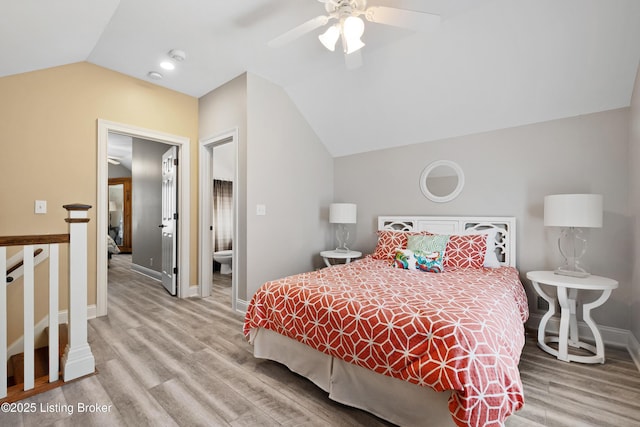 9502 Gerardia Ln, Prospect, KY 40059 - bedroom featuring lofted ceiling, light wood-style floors, baseboards, ensuite bath, and ceiling fan