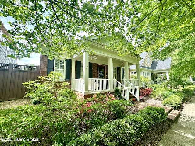 9502 Gerardia Ln, Prospect, KY 40059 - view of front of property featuring brick siding, a porch, fence, and a ceiling fan