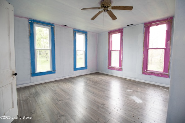 3497 Hundred Acre Pond Rd, Hardyville, KY 42746 - empty room with wood finished floors, baseboards, a ceiling fan, and visible vents