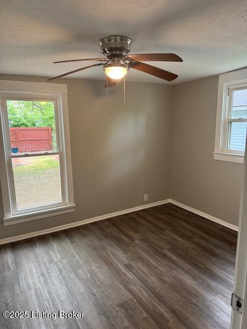 715 W Evelyn Ave, Louisville, KY 40215 - empty room featuring dark wood finished floors, baseboards, a textured ceiling, and a ceiling fan