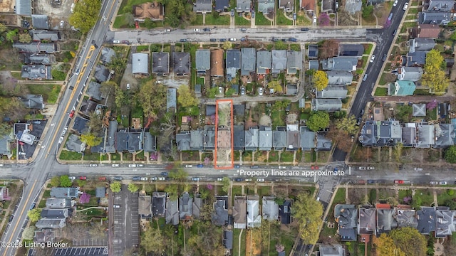 birds eye view of property with a residential view