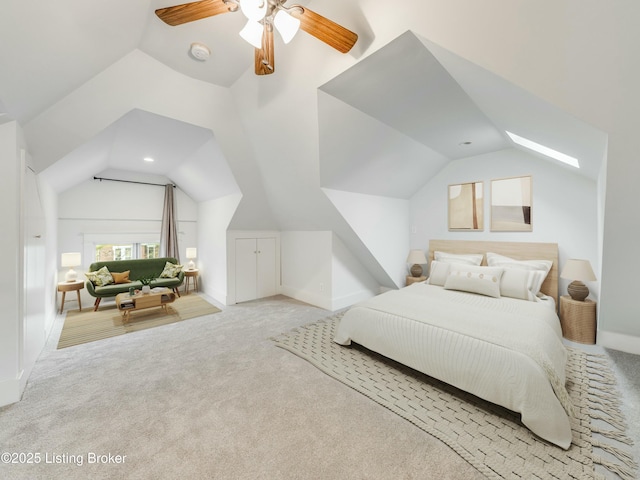 bedroom with ceiling fan, carpet, vaulted ceiling, and baseboards