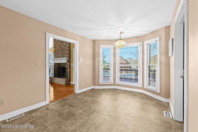 235 Ashford Dr, Mt Washington, KY 40047 - unfurnished dining area with a chandelier, baseboards, and a fireplace