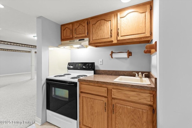 235 Ashford Dr, Mt Washington, KY 40047 - kitchen featuring under cabinet range hood, range with electric stovetop, a sink, dark countertops, and brown cabinets