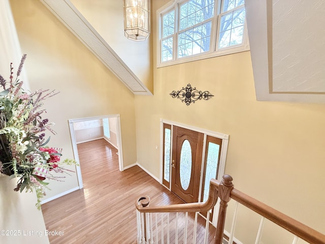 235 Ashford Dr, Mt Washington, KY 40047 - entrance foyer with wood finished floors, a towering ceiling, baseboards, and a chandelier