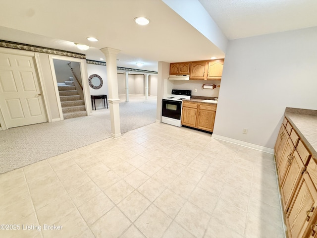 235 Ashford Dr, Mt Washington, KY 40047 - kitchen with electric range oven, under cabinet range hood, recessed lighting, light tile patterned floors, and baseboards