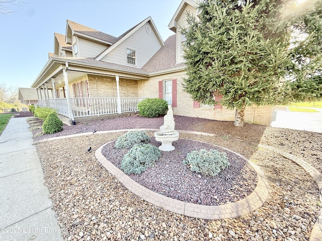 235 Ashford Dr, Mt Washington, KY 40047 - view of front of home featuring a shingled roof, covered porch, and brick siding