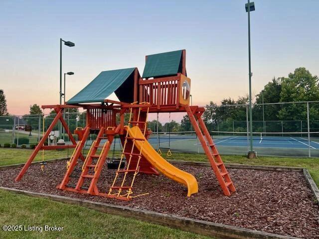 235 Ashford Dr, Mt Washington, KY 40047 - playground at dusk featuring a tennis court