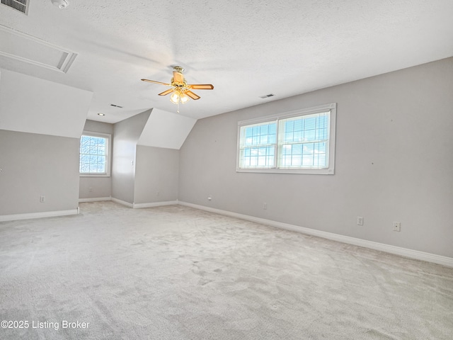 235 Ashford Dr, Mt Washington, KY 40047 - additional living space with ceiling fan, a textured ceiling, light colored carpet, and baseboards