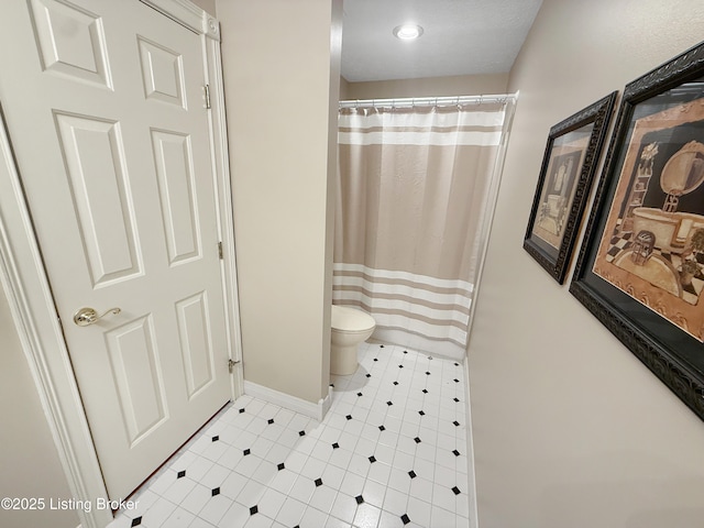 235 Ashford Dr, Mt Washington, KY 40047 - full bathroom with toilet, baseboards, tile patterned flooring, and a shower with curtain