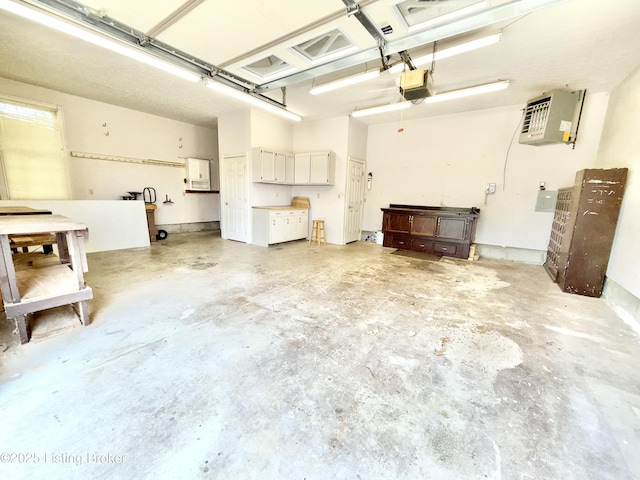235 Ashford Dr, Mt Washington, KY 40047 - garage featuring a garage door opener and a heating unit