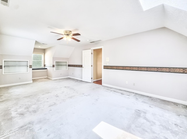 235 Ashford Dr, Mt Washington, KY 40047 - unfurnished living room featuring carpet floors, ceiling fan, baseboards, and vaulted ceiling