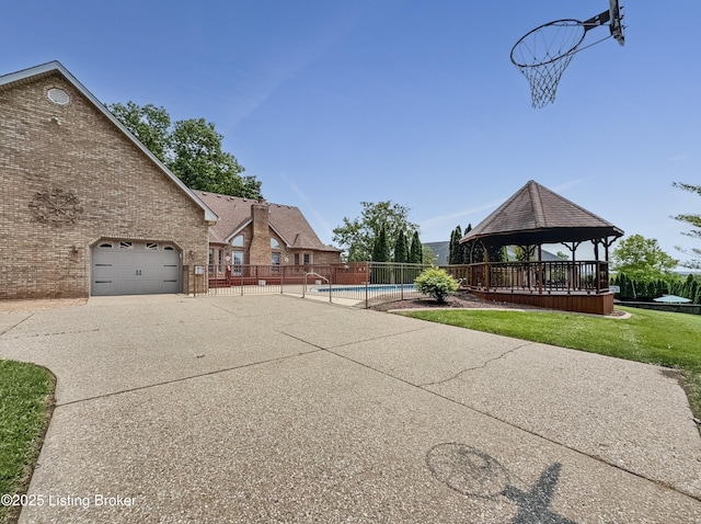 235 Ashford Dr, Mt Washington, KY 40047 - view of community featuring a gazebo, concrete driveway, a pool, and a garage