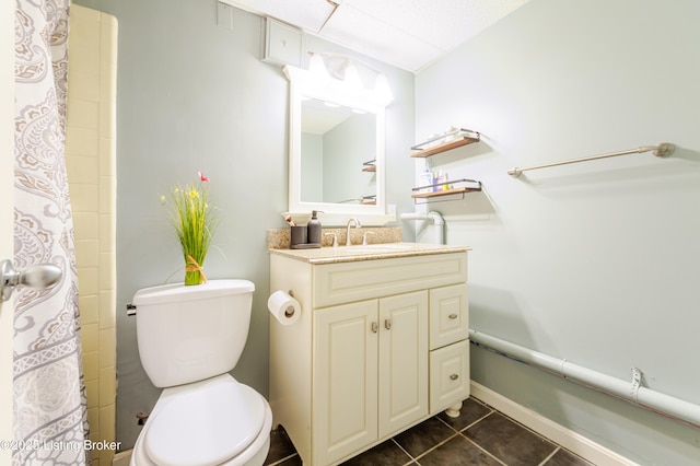 full bath with vanity, tile patterned floors, toilet, and curtained shower