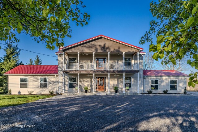 1110 Clark Station Rd, Fisherville, KY 40023 - view of front of home featuring metal roof, a ceiling fan, and a balcony
