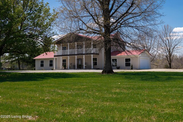 1110 Clark Station Rd, Fisherville, KY 40023 - rear view of property featuring a balcony, driveway, and a lawn