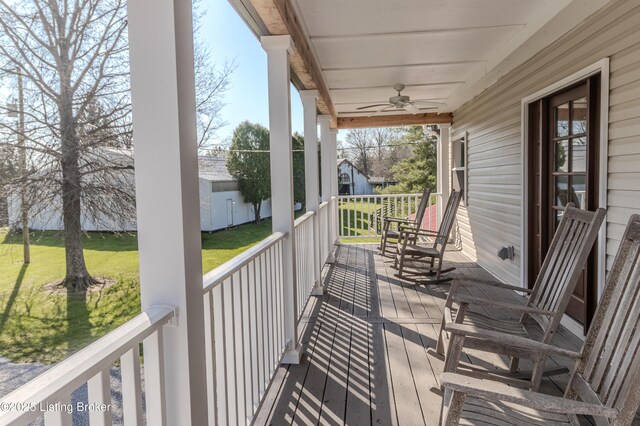 1110 Clark Station Rd, Fisherville, KY 40023 - deck with ceiling fan, covered porch, and a lawn